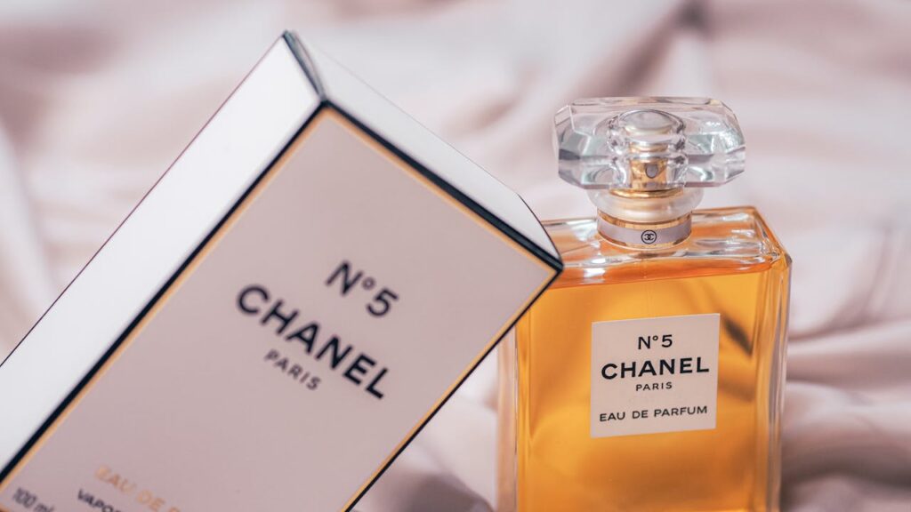 Chanel No.5 Eau de Parfum bottle and box beautifully displayed in a soft setting.